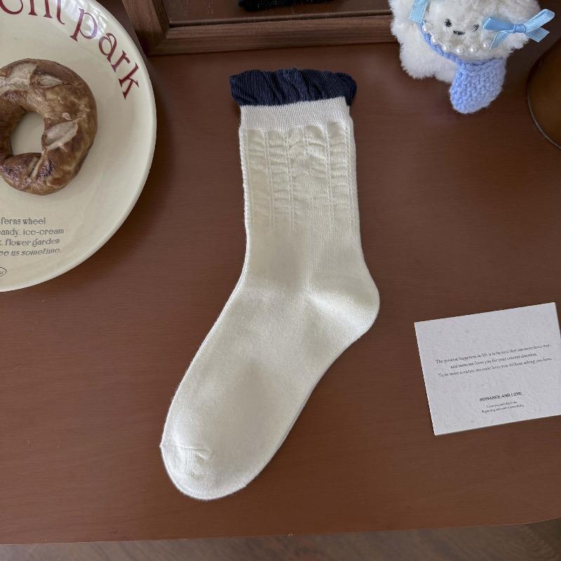 Fall/Winter Children's Socks From Fel Island, Retro Dark Blue School-style Pile Socks with Buttoned and Bow-tied Cuffs.