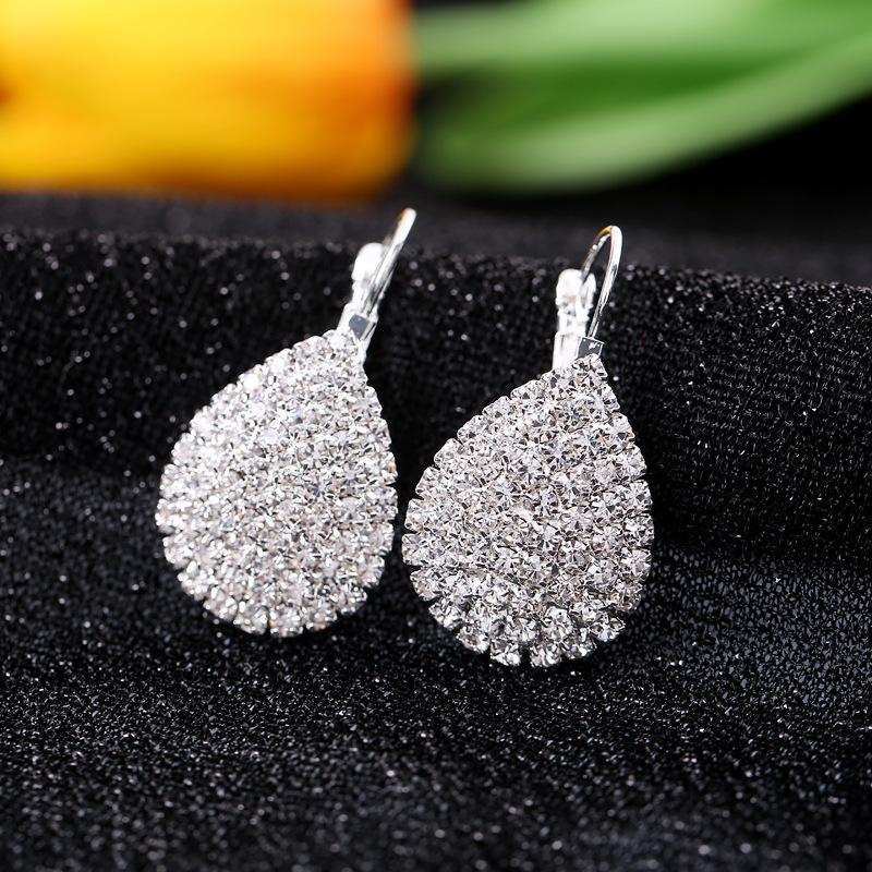 

Жіночі елегантні блискучі сережки-гвоздики зі стразами, ювелірні вироби срібний