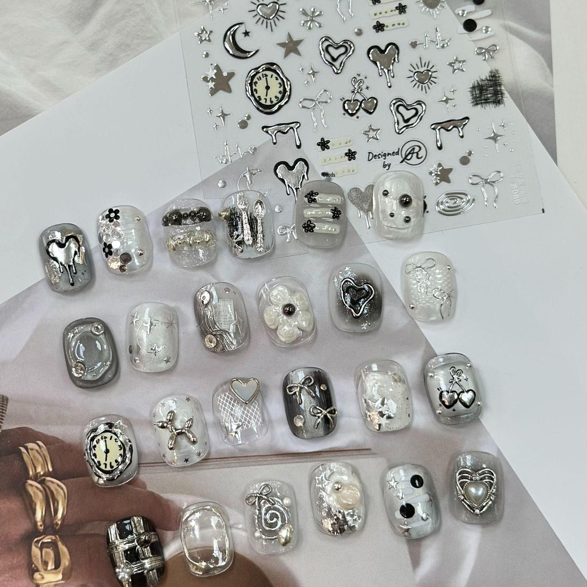 

Tomoni Metal Nail Stickers: DIY Dark Style with Star, Moon, and Heartbeat Designs.