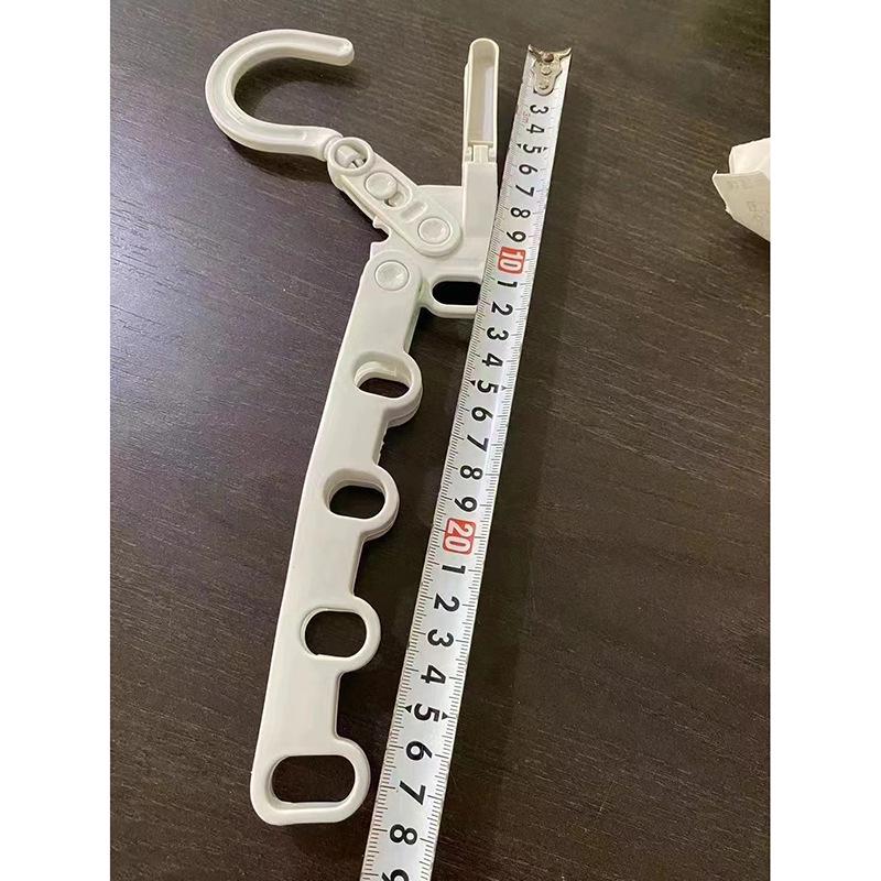 Portable Folding Drying Rack: Multifunctional Travel Hanger with Five Slots for Clothes, Ideal for Hotel and Business Trips.