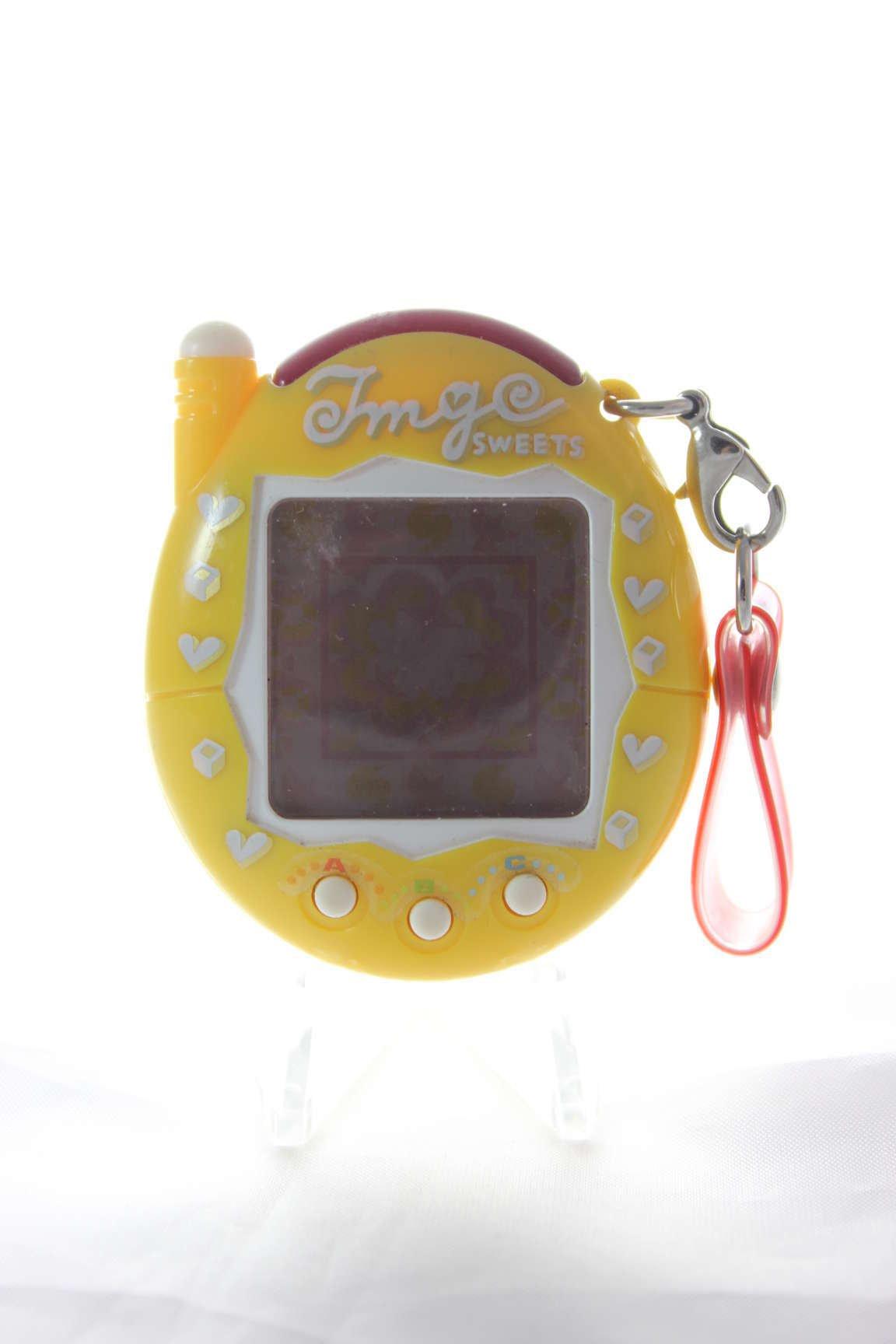 

Мобільний телефон Tamagotchi Plus Red Series Caramel Kai2! жовтий