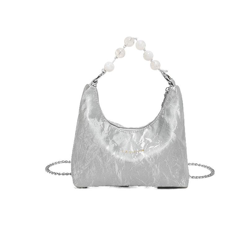 

New Chinese bag women s 2024 spring and summer new hand-held pearl soft leather dumpling bag fashion trend versatile shoulder bag срібний