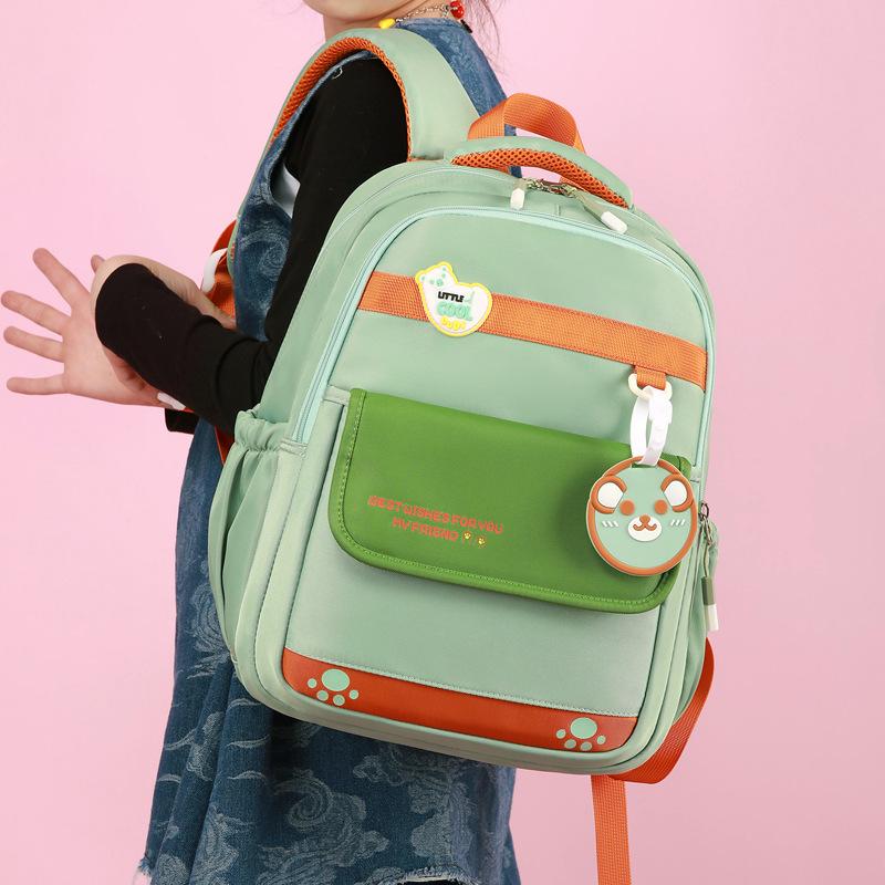 New spine protection for grades 1-6, waterproof boys' children's schoolbag and female primary school students' large-capacity college wind backpack