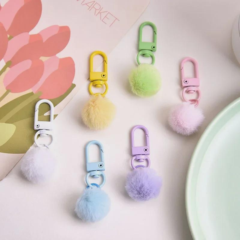 Colorful Milk Pendant Plush Ball Keychain with Macaron Shade and Revolving Buckle.