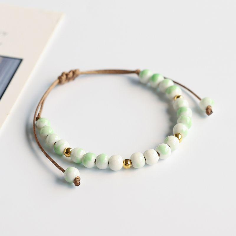

Этнический стиль керамический ювелирный браслет женский новый китайский фарфоровый браслет из бусин пара плетеный ремешок для переноски мальчики нишевый с высоким чувством Glaze Bean Green