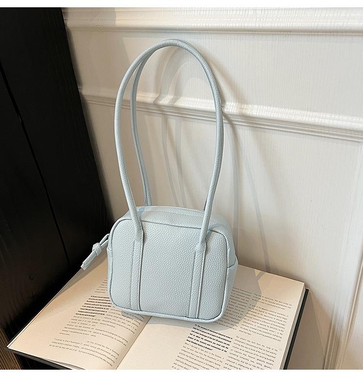 Retro niche portable bowling bag 2025 spring and summer new solid color shoulder bag temperament simple handbag