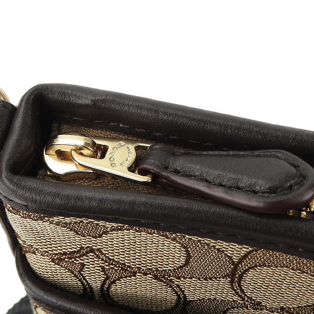 Gebrauchte COACH Umhängetasche F29960 Canvas mit Signature-Muster/Leder beige Dunkelbraun Diagonal getragen