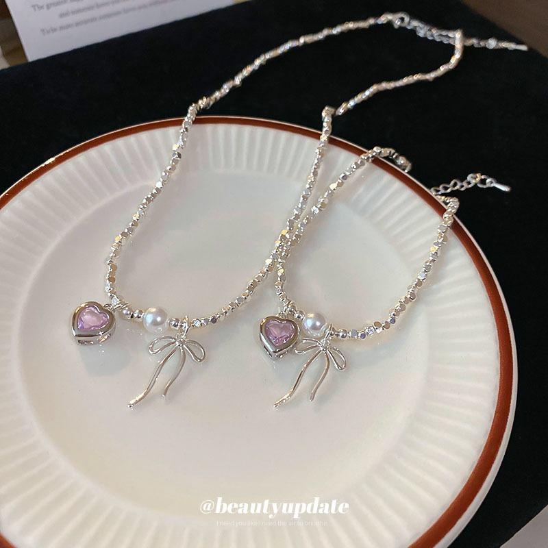 Zircon love bow, broken silver pearl necklace set, high-end light luxury collarbone chain, Korean sweet necklace.