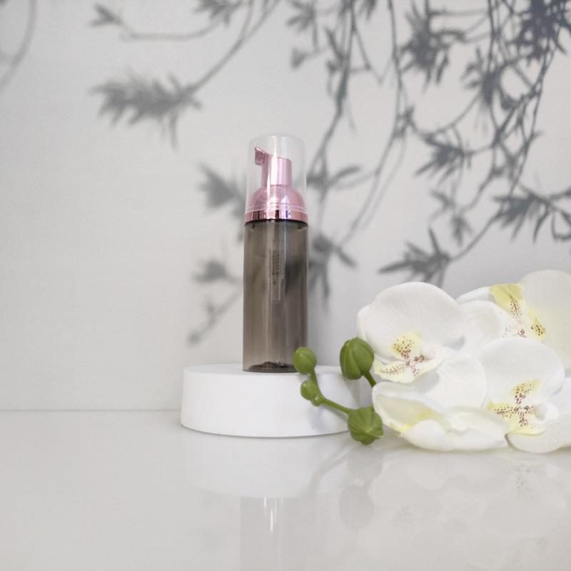 Available 60ml Transparent Black Foam Mousse Bottle for Face Wash and Travel-friendly Cosmetic Packaging.