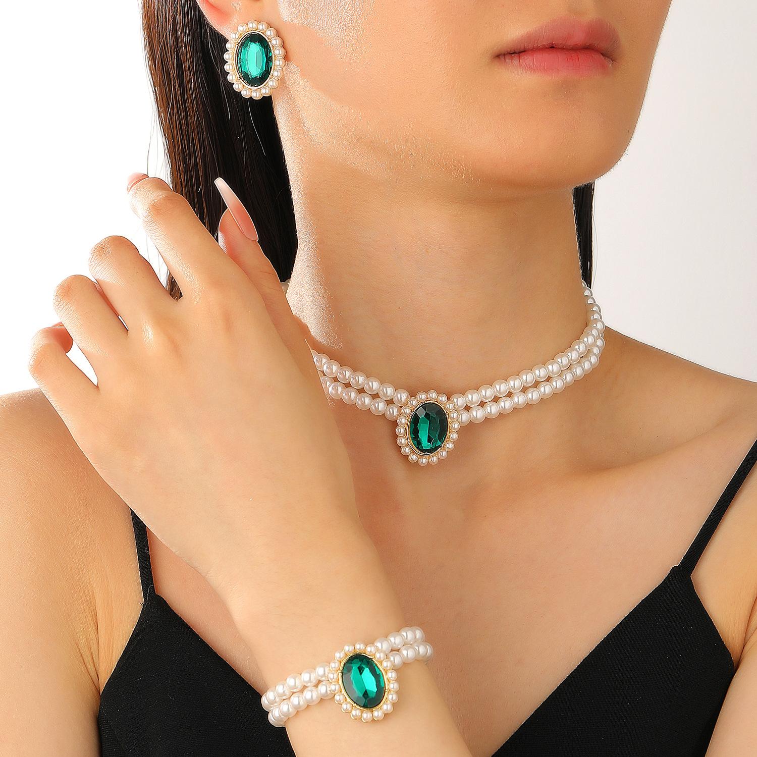 

2026 Внешняя торговля Высокое качество Мода Двухслойное Имитация жемчуга Овальное Кристальное Ожерелье Серьги Браслет Трехкомпонентное Украшение