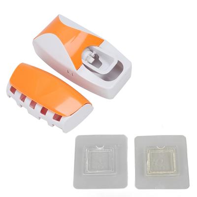 Wandmontierter automatischer Zahnpastaspender Quetscher Zahnbürstenhalter Set für Familienbadezimmer Orange
