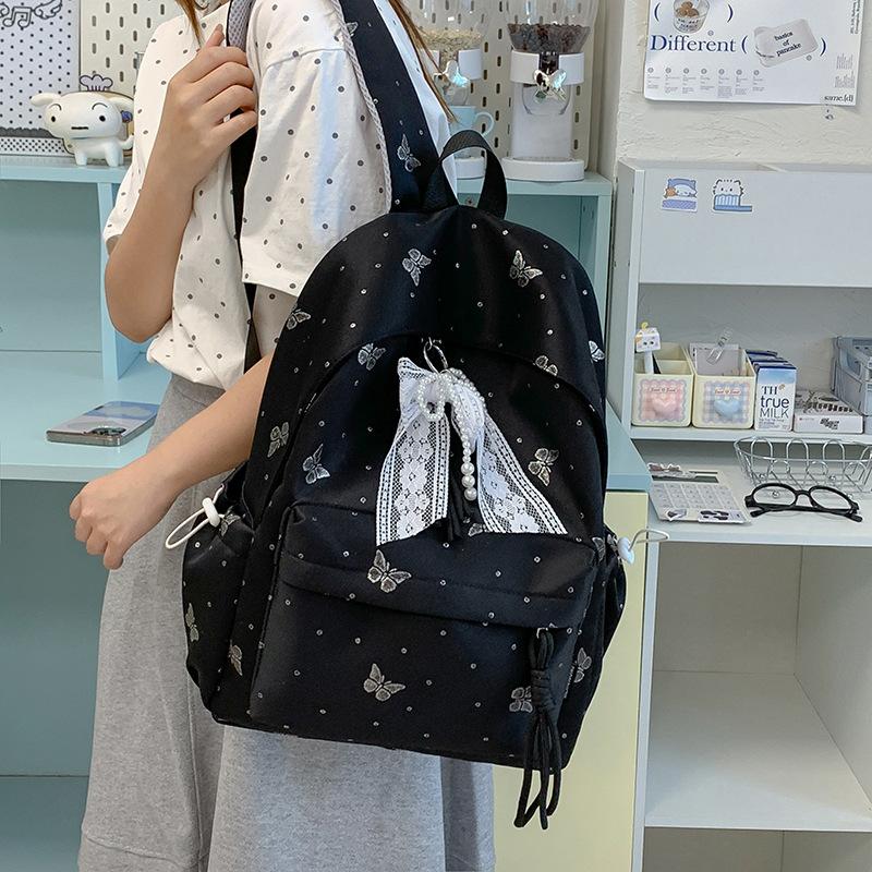 Mochila escolar nueva mochila escolar japonesa femenina estudiantes de secundaria mochila con estampado de mariposas de gran capacidad alto valor ligera versátil