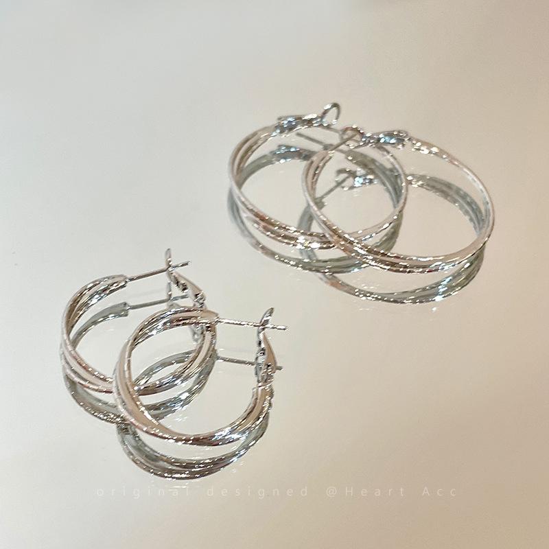Elegant Silver Hoop Earrings with Unique Design for Women