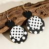 Classic Black & White Polka Dot Dangle Earrings: Bold, Retro Design with Large, Eye-Catching Style