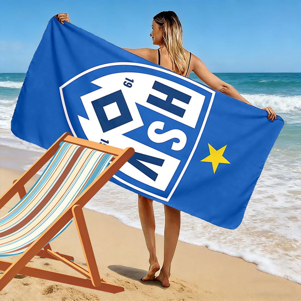 Asciugamano da Spiaggia con Logo HSV Blu Un asciugamano da spiaggia indispensabile per i viaggi in spiaggia