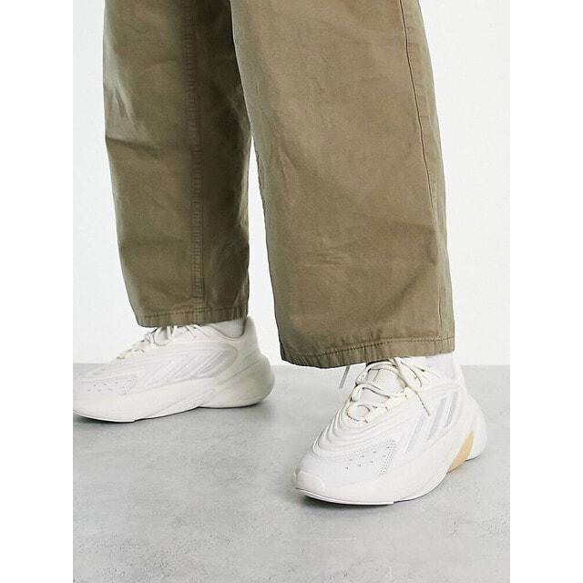 

Белые кроссовки adidas Originals Ozelia с персиковыми деталями
