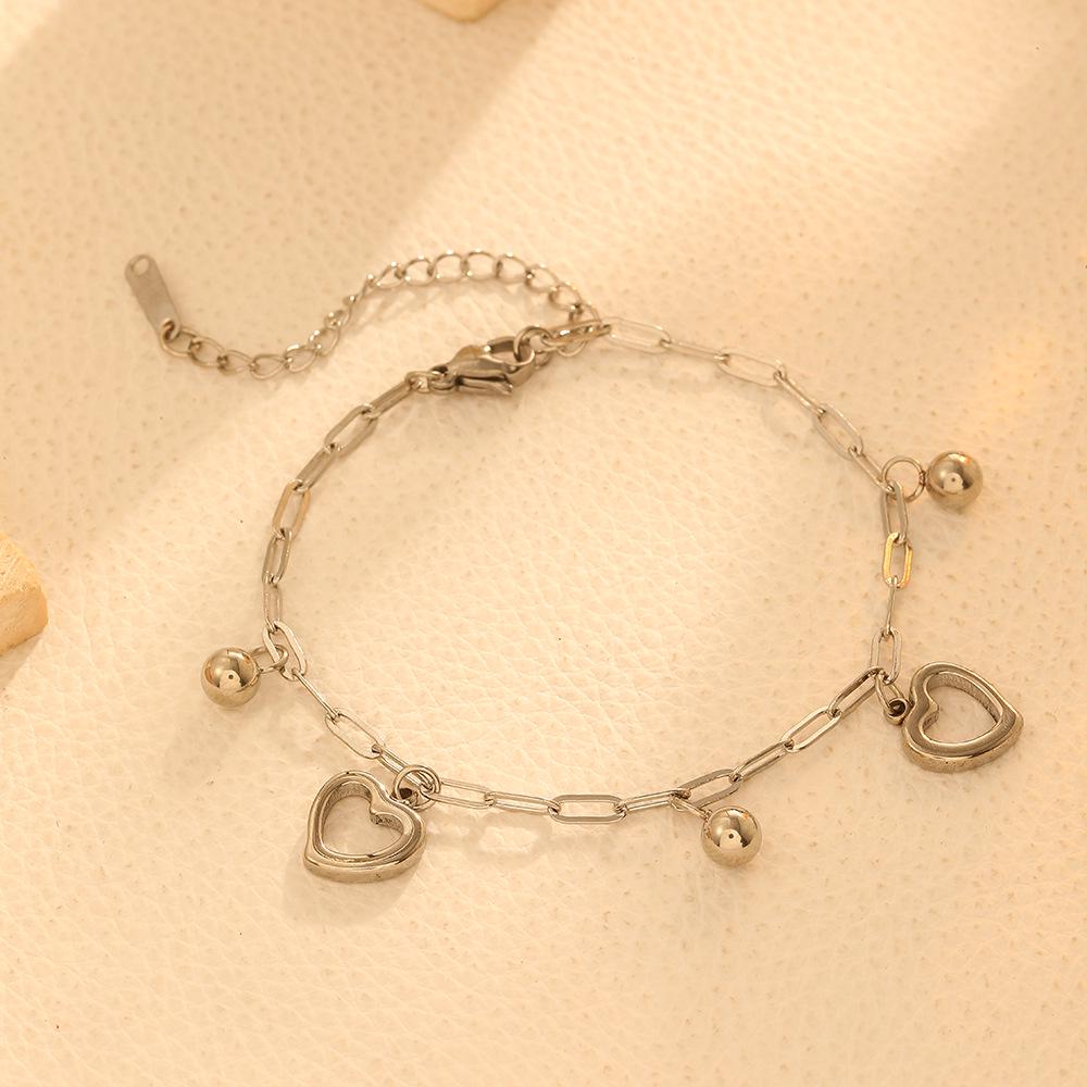 Two Hearts Stainless Steel Bracelet: Fashionable Colorfast Steel Beads with Hollow Peach Heart Design, 18k European and American Style Hand Jewelry.
