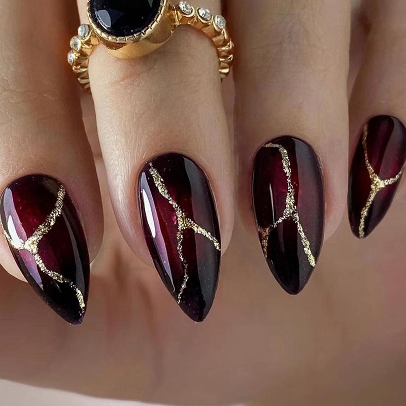 

Chic Almond Nails: European Style with Stone Texture and Gold Highlights in Dark Red