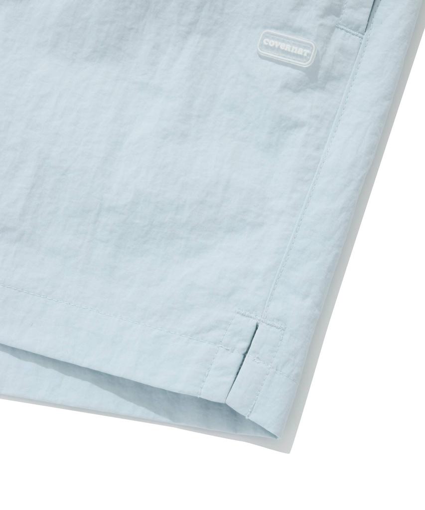 COVERNAT WOMAN Sheer Nylon Windbreaker Shorts Light Blue