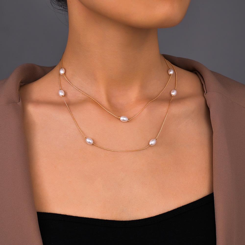 

Korean version of sweet lady necklace, pearl double stacked metal necklace, neck chain, collarbone chain. золотий