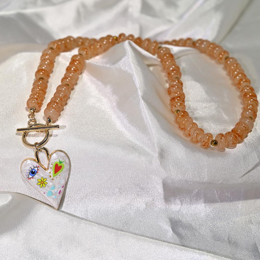Handgjort Retro Majskol-Färgat Glas Hjärta Hängsmycke Halsband med Pärlband Choker för Kvinnor