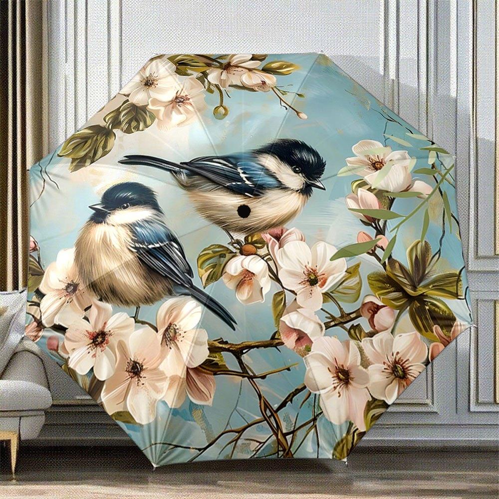 

Folding Umbrella The folding umbrella features a pattern of blooming flowers and perched birds, including species like the Blu