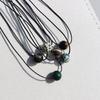 Unisex Retro Geometric Stone Pendant Necklace with Rotating Bead & Leather Cord – Versatile, High-End, Colorfast Design for Women & Men