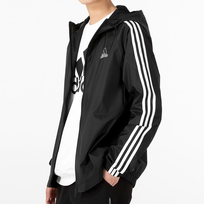 Adidas Chaqueta cortavientos con capucha de 3 rayas para hombre Ropa de abrigo Negro HE4322