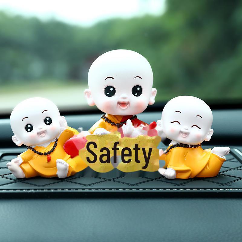 Creative Little Monk Maitreya Buddha Car Ornament: Cute, Shaking Head Resin Doll for Car Interior Decoration and Safety.