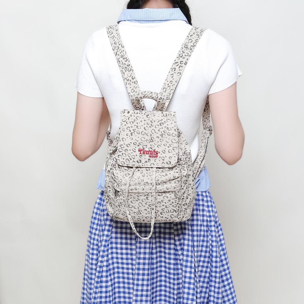 A Canvas Backpack with Polka Dots and A High Level of Appearance