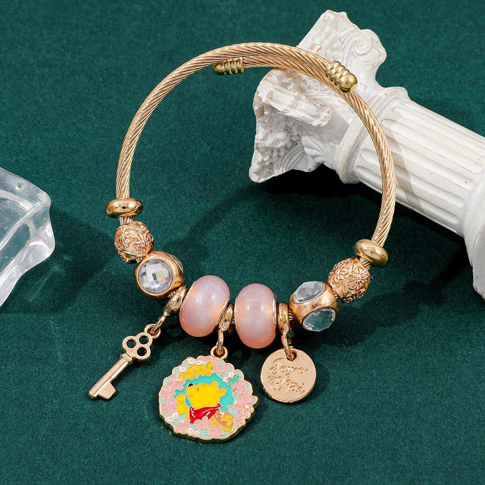 Winnie Puuh Handkette für Damen und Teenager mit goldenen Zinklegierungsperlen und Cartoon-Design
