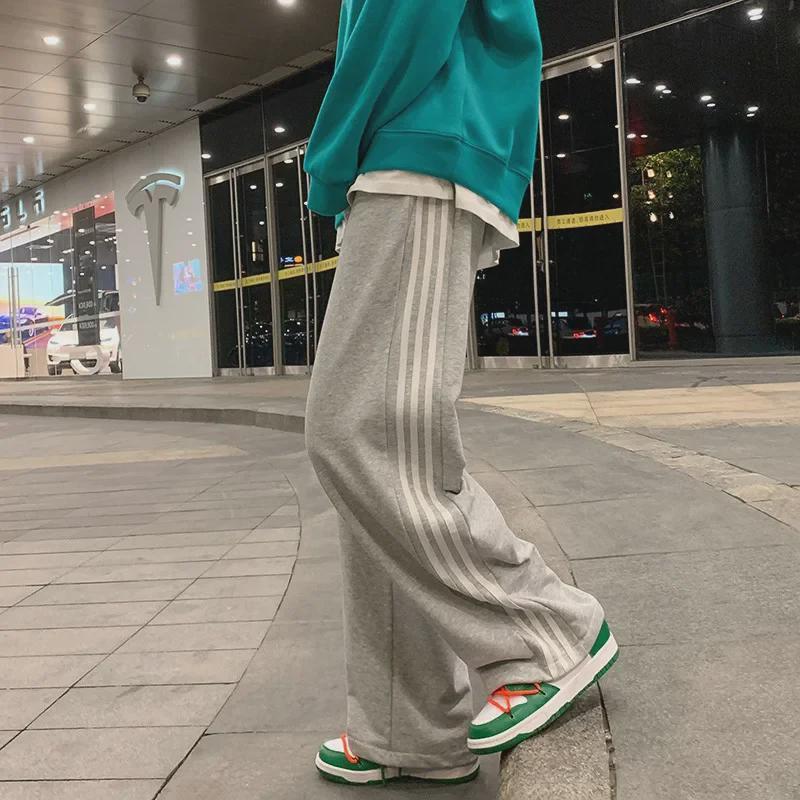 Damskie spodnie sportowe w paski w stylu koreańskim - luźne, sięgające do ziemi, w jednolitym kolorze, na wiosnę i jesień
