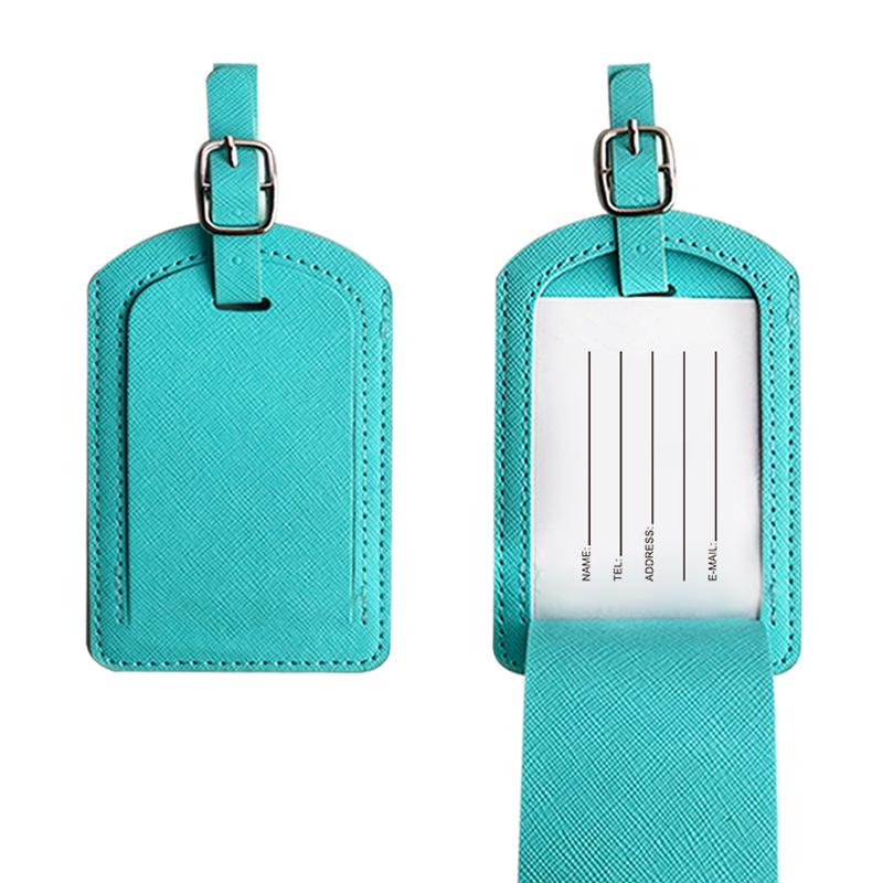 

Бирка для багажа из искусственной кожи с разноцветным крестообразным узором и двухслойной окантовкой небесно-голубой