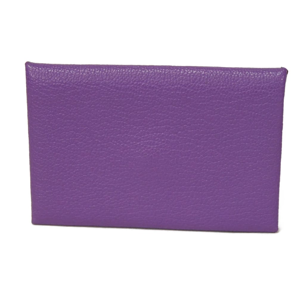 Used 9212 Calvi 7946 Chevre Mysore Goatskin Bag with Gold-stamped Logo and Purple Snap Buttons. Excellent Condition.