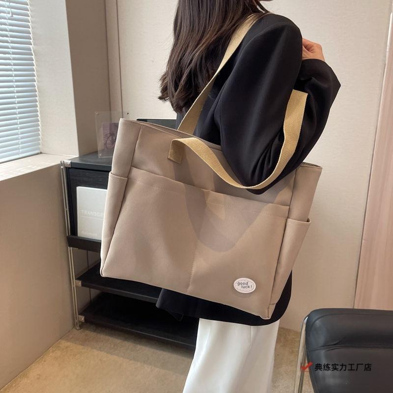 Large capacity lazy wind canvas bag women's solid color niche shoulder handbag casual versatile commuter tote bag