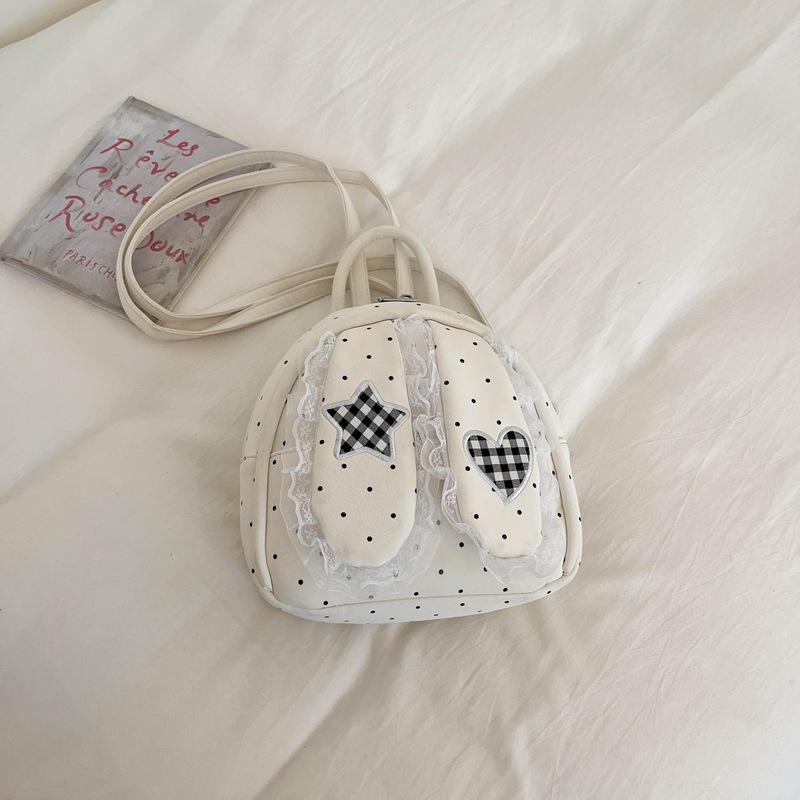 Schoolbag handsome rice family Korean simple foreign style polka dot love rabbit ear backpack 1011 spring new commuter student backpack