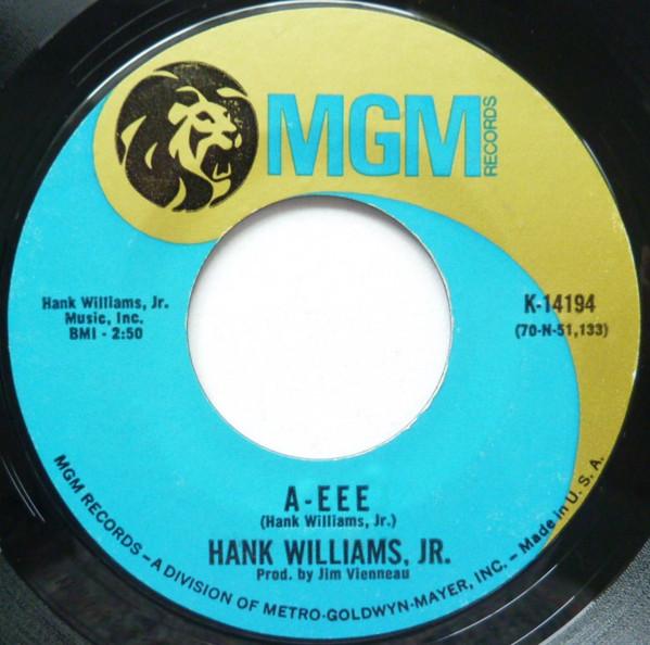 

7-дюймовая пластинка ХЭНК УИЛЬЯМС МЛ.. - A - Eee / Rainin In My Heart K14194 MGM Records 1970 США Фолк Б/У