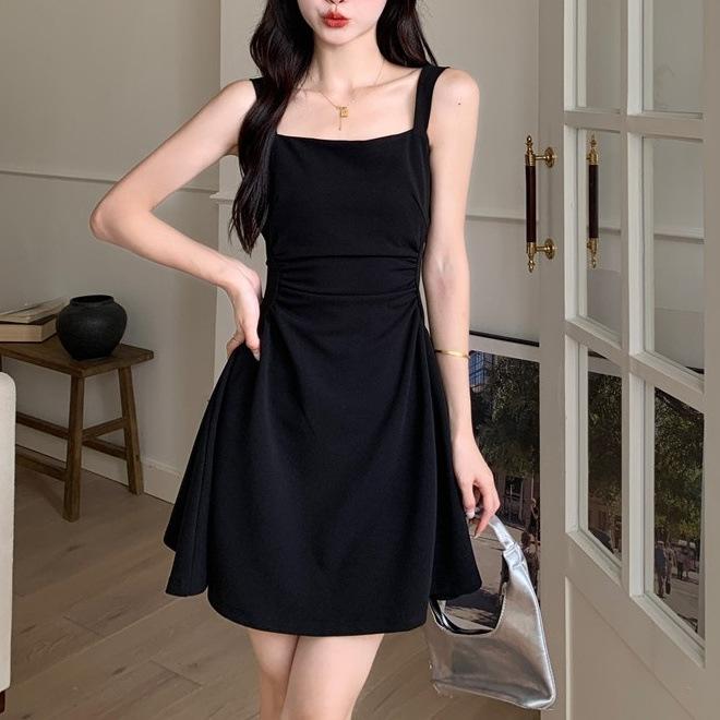 Fashion waist fold design suspender dress women's early spring Korean version fashion solid color high-end medium and long skirt