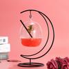 One individual drink, glass of water, hanging cocktail, creative glass.