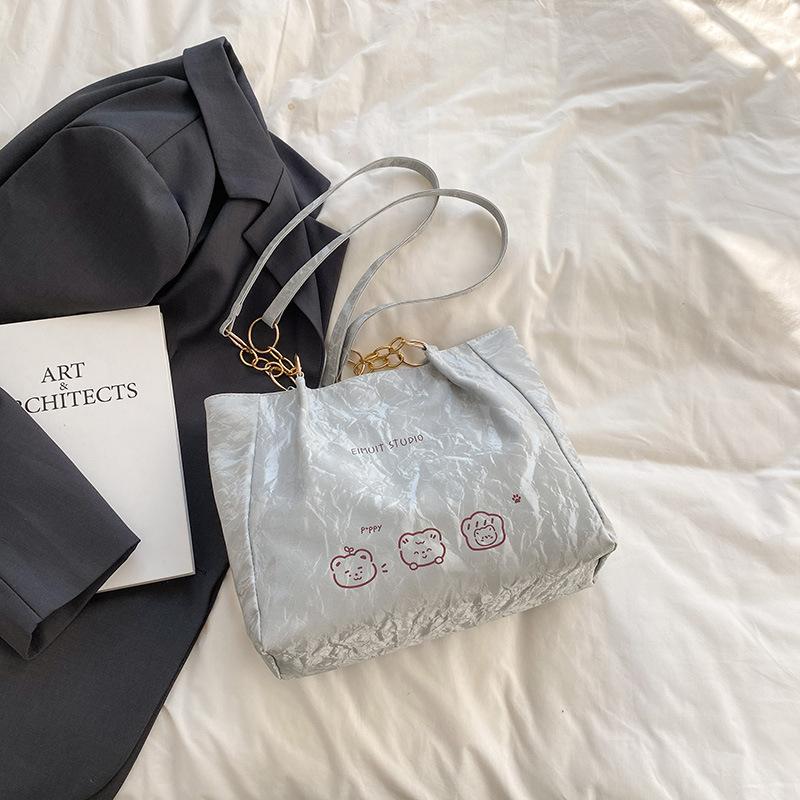 

Женская сумка 2025 весна новая сумка большой вместимости женская нишевая зарубежный стиль модная простая сумка-тоут на плечо в зарубежном стиле серый