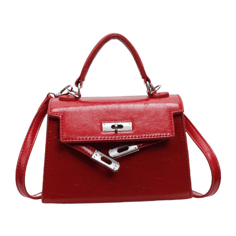 

Цього року сумки-ніші популярні серед жіночих сумок-месенджерів 2024 року нової моди із замком, високоякісних сумок-месенджерів на одне плече в іноземному стилі. бордовий