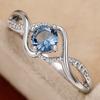 Huitan Elegant Women Ring Twist Design Inlaid Sparkling Blue CZ Fashion Party Engagement Noble Lady Accessories Delicate Zircon