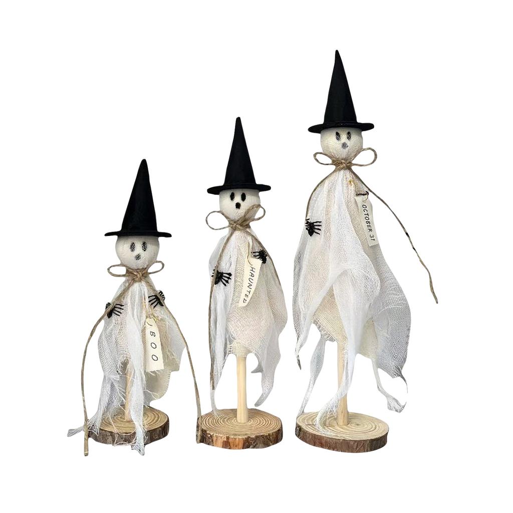 Three Halloween Are Placed On A Wooden Stand In The Center Of The Halloween Desktop For Indoor Decoration