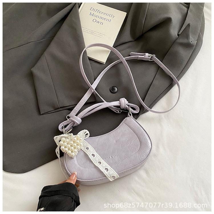 Handbag 2025 spring new niche ins shoulder temperament simple fashion Korean version messenger bag crescent bag women