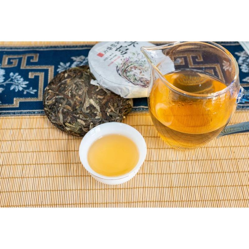 100g Pu'er Raw Tea Iceland Yunnan Ancient Tea Spring Tea Cake Orchid Fragrance