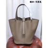 Spot wholesale top layer cowhide vegetable basket bag leather bucket bag commuter fashion lock buckle hand-held handbag woman