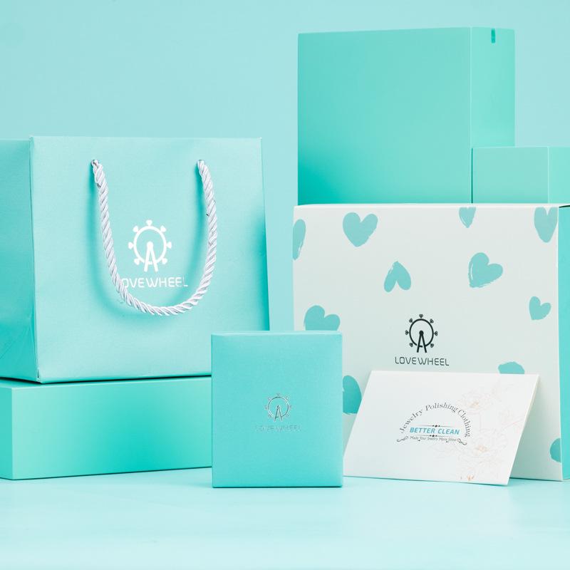 Ferris Wheel Gift Set: Box with Top/Bottom Cover, Envelope, Handbag, Jewelry Box, Silver Polishing Cloth.