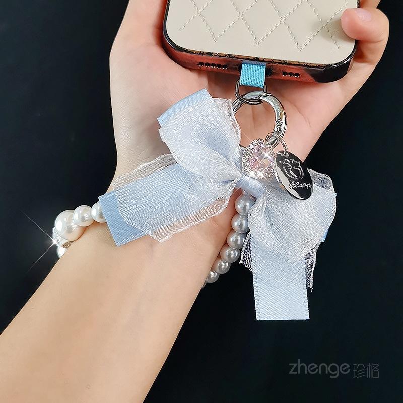 Mesh bow pearl bracelet women's ins fashion Xiaoxiangfeng mobile phone pendant mobile phone lanyard short wrist