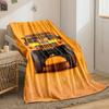 Front view of a bright yellow rugged vehicle against an orange background. for all seasons blanket lunch break throw gift