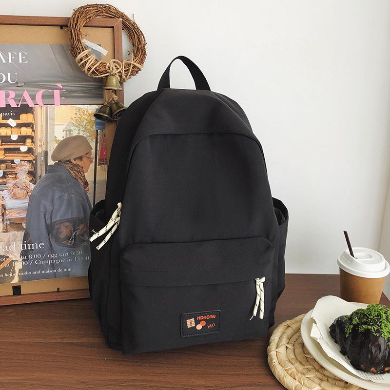 New casual simple solid color backpack large capacity junior high school student schoolbag